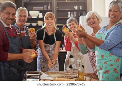 Good Cooks Never Lack Friends. Shot Of A Group Of Seniors Attending A Cooking Class.