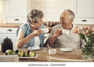 A good cup of coffee sets the tone for the day. Shot of a senior couple having breakfast together at home. - Powered by Shutterstock