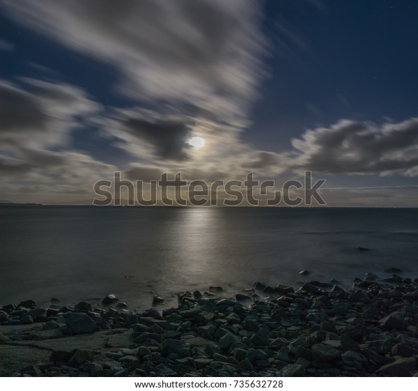 Good evening wales, Harvest moon reflected\
off the sea at Pwllheli, Gwynedd,\
wales