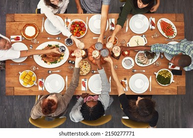 Good Food Is Even Better With Good Friends. Shot Of A Group Of People Sitting Together At A Dining Table Ready To Eat.