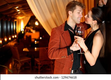 To A Good Girl Flirting Young Man With A Glass Of Wine