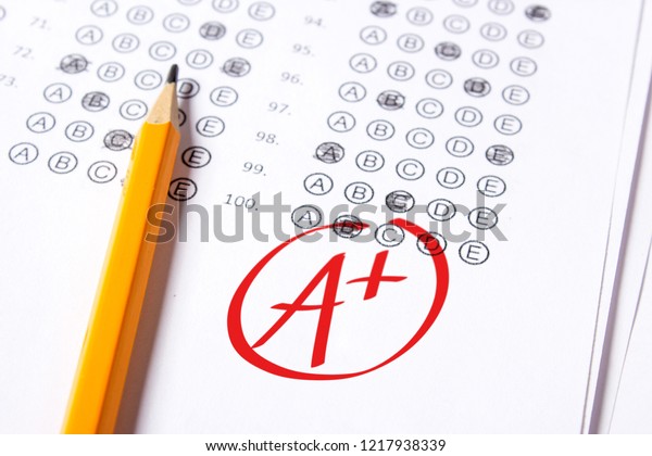 Good grade of A plus (A+) is written with  red pen\
on the tests.