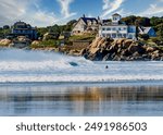 Good Harbor Beach is a picturesque and popular destination located in Gloucester, Massachusetts. The large, white cottage is known as Sherman Cottage, built in the 1880