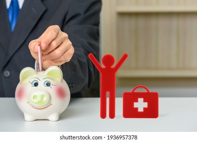 Good Health Can Save Money, Healthcare Concept : Patient Save Money In A Piggy Bank With A Red Doll And A Suitcase, Depicts Good Health Habits Can Reduce Health Care Cost And Expenditure For Insurance