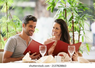 It Was A Good Idea Coming To This Restaurant. A Happy Young Couple On A Date At A Fancy Restaurant.