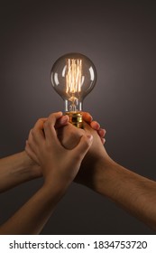 Good idea concept, Edison bulb in family hands
