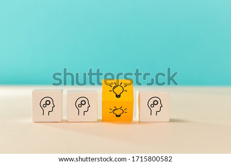 Good idea. Creative thinking, innovation. Brainstorming. Think different. Wooden cubes with human head, lightbulb signs