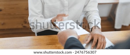 Good job, asian manager man giving financial reward in an envelope, business letter extra salary to company employee, caucasian male worker office hand received premium bonus, getting cheque from boss