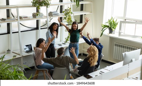 Good job! Happy laughing excited diverse coworkers teammates friends having fun meeting at break time in office area receiving reward for successful work, celebrating victory, achievement, good news - Shutterstock ID 1849643608