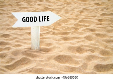 Good Life Arrow Sign On The Beach