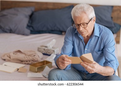 Good Looking Aged Man Reading A Note