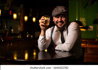 good looking guy is sitting at the bar  - Shutterstock ID 1645652782
