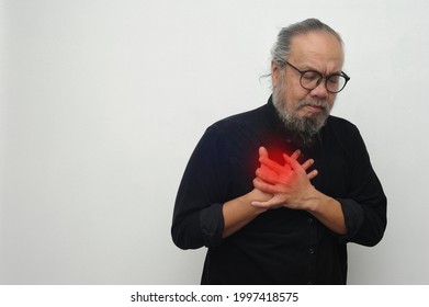 Good looking old man having chest pain heart attack or cardiac arrest with red spot highlight area in white clean background 