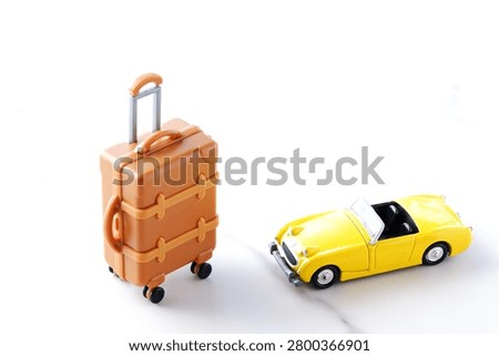 Good looking open two seater car with a luggage