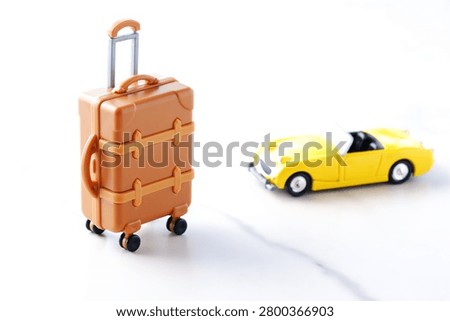Good looking open two seater car with a luggage
