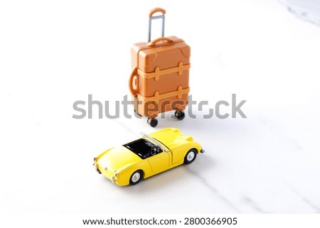 Good looking open two seater car with a luggage