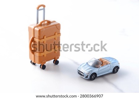 Good looking open two seater car with a luggage