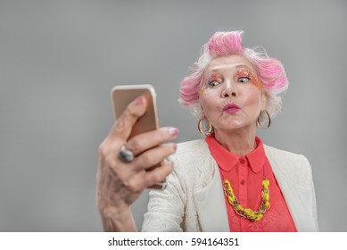 Good looking senior blond woman posing at camera - Shutterstock ID 594164351
