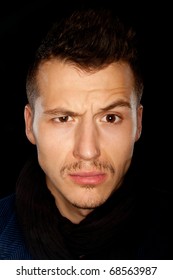 Good Looking Young Man With Eyebrow Raised - Studio Shot