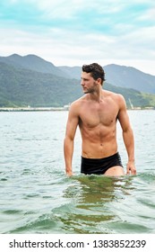 Good Looking Young Man In Sea, Looking Away