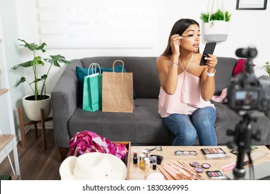 Good Looking Young Woman Recording A Makeup Tutorial With A Dslr Camera At Home Using Some Mascara