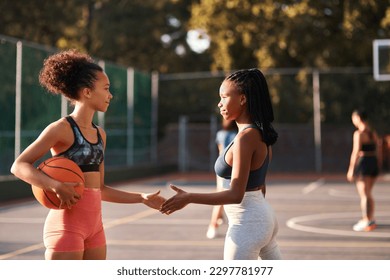 Good luck. Low angle shot of a diverse group of friends huddled together before playing basketball during the day. - Powered by Shutterstock