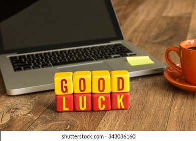 Good Luck Written On A Wooden Cube In A Office Desk