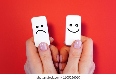 Good mood and bad mood concept with blocks and smiles in a hands  - Shutterstock ID 1605256060