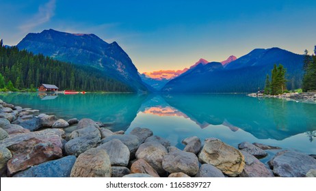 Good mornig Lake Louise.  {Panoramic view of the world famous Lake Louise from shore line to Victoria Glacier.  From the boat rental house to the shore the Chateau Lake Louise.
