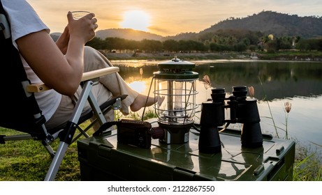 Good morning. Asian woman travel and camping alone at natural park in Thailand. Recreation and journey outdoor activity lifestyle. - Shutterstock ID 2122867550