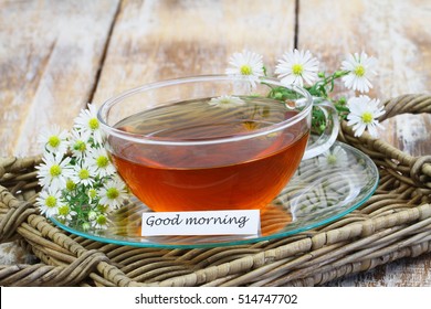 Good Morning Card With Chamomile Tea In Transparent Cup With Fresh Chamomile Flowers
