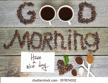 good morning and have a nice day concept - coffee beans, Cup of black coffee, heart from coffee beans, coffee leaves. Toned, selective focus image. lovely message