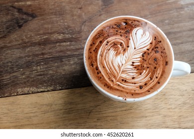 Good morning with hot chocolate on wood table, beautiful art on cup of hot chocolate  - Powered by Shutterstock - Get 15% off with code: PIKWIZARD15