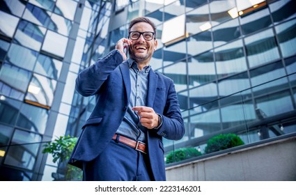 Good news about project. Smiling businessman talking with client on the way to office. Business, lifestyle concept - Shutterstock ID 2223146201