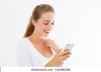 Good News Phone. Excited Happy Girl Reading Good News On Smart Phone Standing In White Transparent Background. Young Beautiful Smile Woman And Phone.