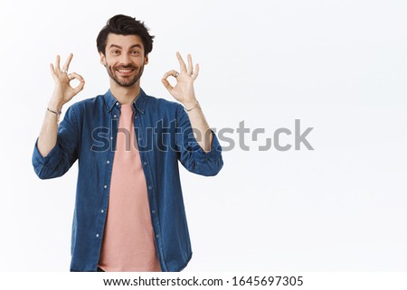 Good, nice choice. Supportive friendly and happy handsome bearded man rate something, give positive feedback, show okay, approval signs and smiling, nod in agreement, like idea, white background