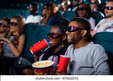 Good Old Movie Date. Happy Couple Smiling Joyfully While Watching A Movie At The Local Cinema 