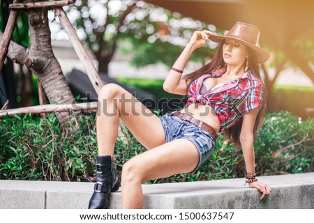Good at riding. Beautiful cowgirl enjoying life in the countryside