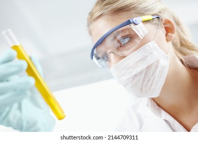 Good Scientists Believe That Anything Is Possible. Closeup Of A Female Scientist Looking At A Test Tube Filled With Liquid.