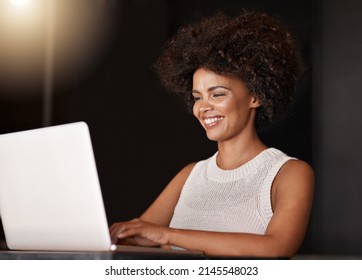 Its Good To See My Business Trending On Social Media. Shot Of A Young Business Owner Using A Laptop While Sitting In Her Cafe.