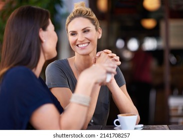 Its So Good To See You Again. Two Attractive Women Sitting Outside A Cafe.