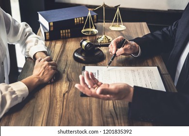 Good service cooperation, Consultation of Businesswoman and Male lawyer or judge counselor having team meeting with client, Law and Legal services concept. - Shutterstock ID 1201835392
