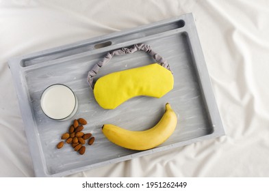 Good Sleep Foods - Banana, Milk,  Almonds And Sleep Mask. Insomnia Treatment. Healthy Night Sleep. Yellow And Gray. Bedtime Routine.