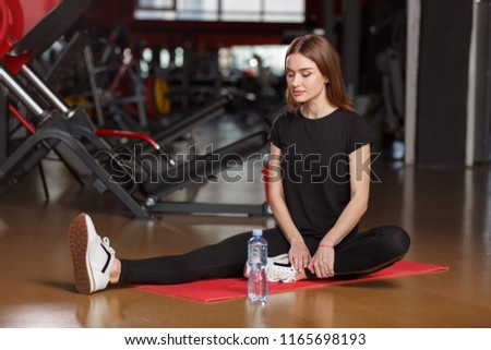 Good stretching in the gym.Young woman workout in gym healthy lifestyle