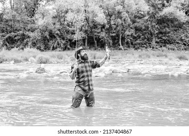 Good things for Good Moments. hobby and sport activity. bearded fisher in water. fisherman show fishing technique use rod. mature man fly fishing. man catching fish. summer weekend. Happy fly fishing