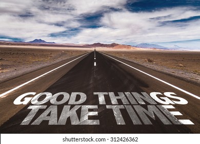 Good Things Take Time written on desert road - Shutterstock ID 312426362
