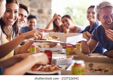 Good times with great pizza. Cropped shot of a group of friends enjoying pizza together. - Shutterstock ID 2137126541