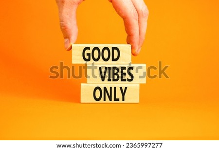 Good vibes only symbol. Concept word Good vibes only on beautiful wooden block. Businessman hand. Beautiful orange table orange background. Business motivational good vibes only concept. Copy space.
