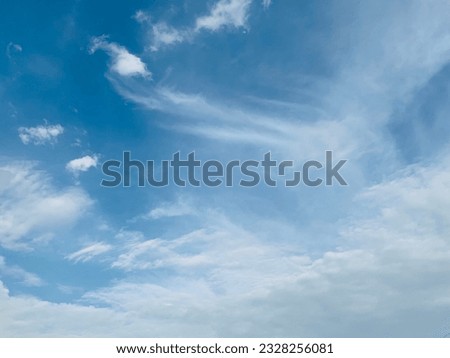 Good weather, cirrus clouds flapping their beautiful white tails in the sky at Bangkok,Thailand.no focus