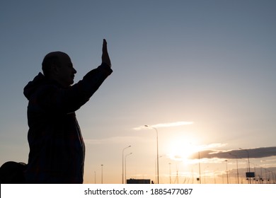 Goodbye Concept. Silhouette Of Middle Aged Man Waving His Hand Standing Alone At The Morning.